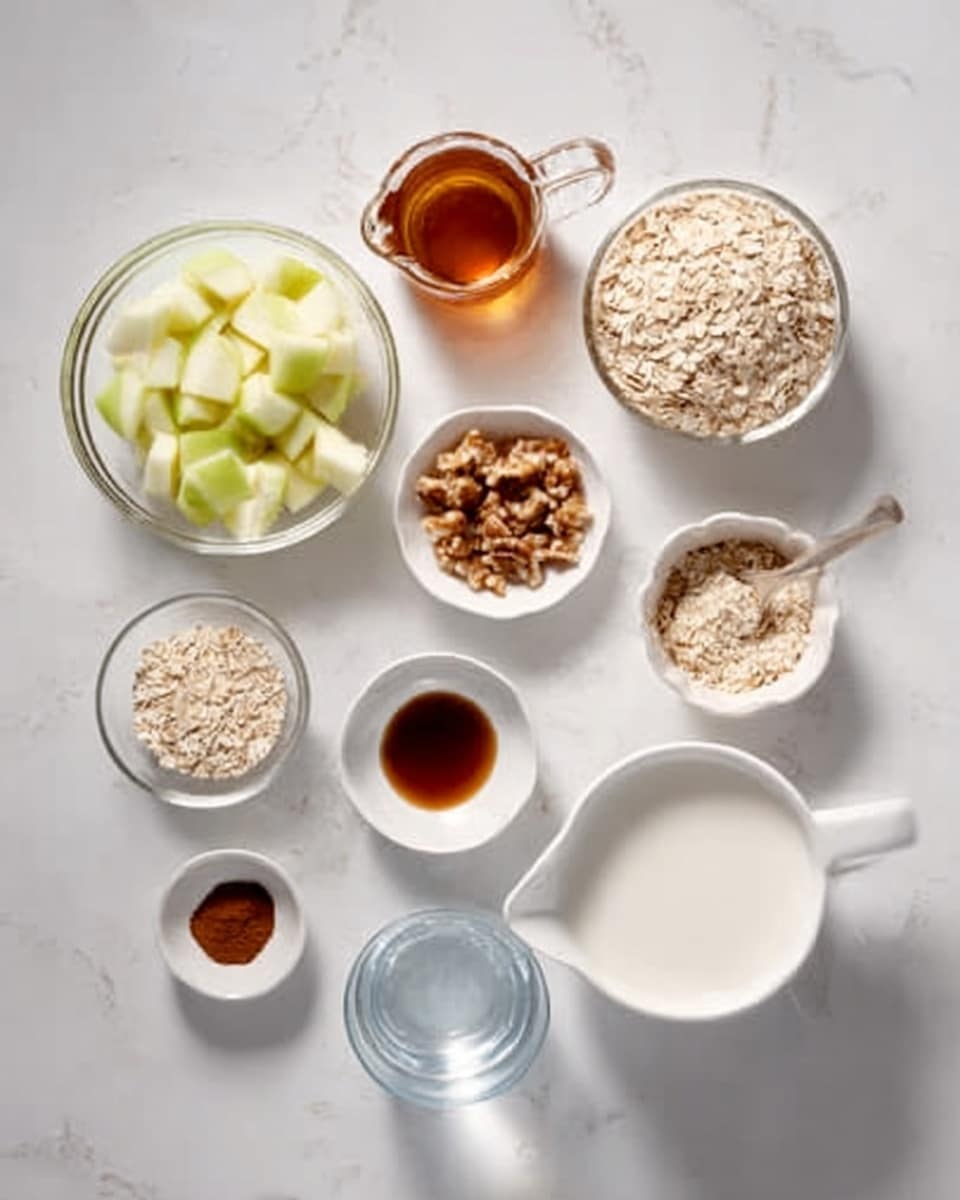The image shows a clean arrangement of nine clear glass containers and small white bowls placed on a white marbled surface. Each container holds different ingredients: chopped pale green apple pieces in one, light beige rolled oats in another, rich dark amber honey in a small pitcher, light brown chopped nuts, a tiny white bowl with dark brown cinnamon powder, a small white bowl with a few drops of dark vanilla extract, a white cup of creamy white milk, a clear measuring cup with smooth white liquid, and a clear glass with water. The whole setup is neat and bright with soft natural light highlighting the textures and colors of the ingredients. Photo taken with an iphone --ar 4:5 --v 7