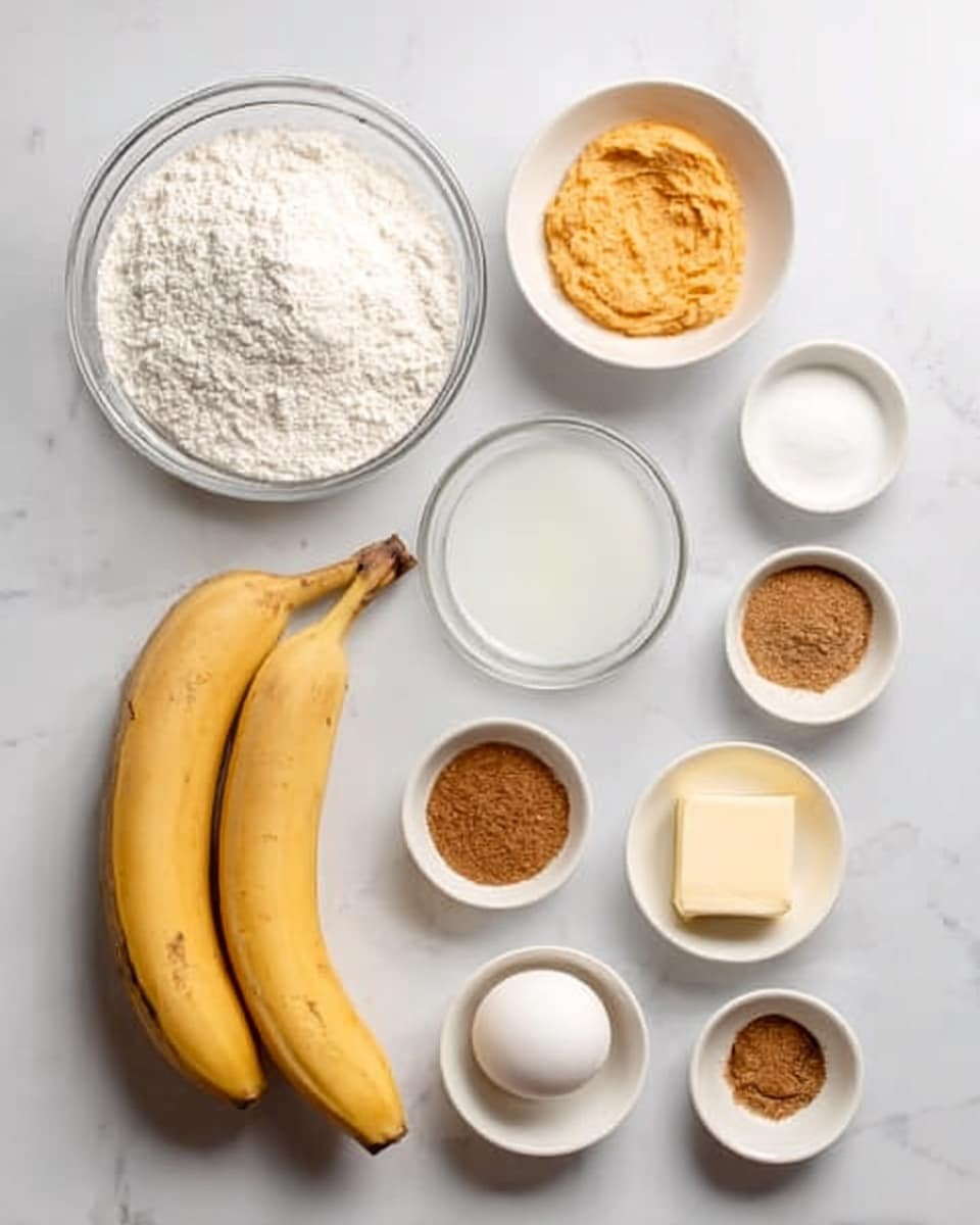 The image shows ingredients for baking on a white marbled surface. There are two yellow bananas with brown spots on the left bottom corner. Above them, a white bowl filled with white flour is placed. Next to the flour bowl is a small white bowl containing orange mashed pumpkin. To the right of the pumpkin, a tiny white bowl has brown sugar and a pinch of cinnamon. Below the bowls, a clear glass cup holds milk, and beside it is a white egg. In the front, a small white bowl with melted butter is visible, along with two other small white bowls holding white sugar and cinnamon powder. The arrangement is neat and spaced out evenly. Photo taken with an iphone --ar 4:5 --v 7