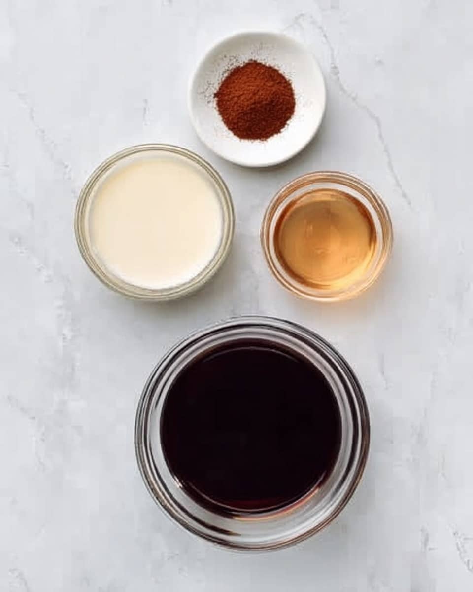 The image shows three small clear glass bowls placed on a white marbled surface. The largest bowl is filled with a dark brown liquid and sits at the bottom center. Above it to the left, there is a medium bowl containing an off-white creamy liquid. To the right of the creamy bowl, there is a smaller bowl filled with a light amber liquid. Above all three bowls at the top center, there is a small white dish holding a reddish-brown powder. The arrangement is neat and symmetrical, creating a simple and clean look. Photo taken with an iphone --ar 4:5 --v 7