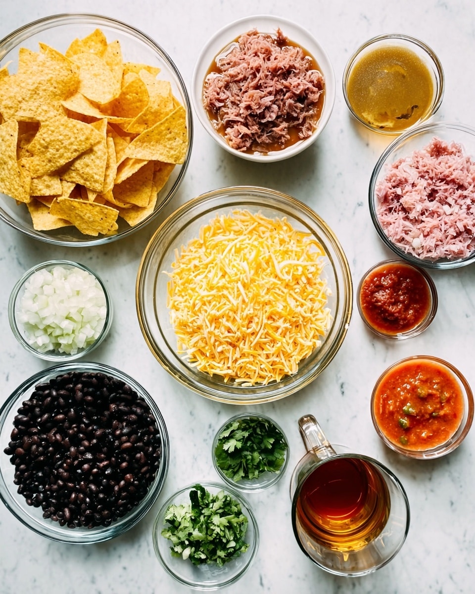 A collection of ingredients is arranged in clear glass bowls on a white marbled surface. The bowls contain several distinct layers: one bowl holds light yellow tortilla chips with a crunchy texture, another bowl is filled with shiny black beans, and a separate bowl is full of finely shredded pale yellow cheese. There are also small bowls with finely chopped white onions, pink shredded meat, chopped green cilantro, and three different sauces – a dark red sauce, a rich tomato salsa with chunks, and an orange sauce with a smooth texture. Nearby is a clear glass mug filled with brown tea. The composition is neat and colorful, showcasing each ingredient clearly with bright lighting. Photo taken with an iphone --ar 4:5 --v 7