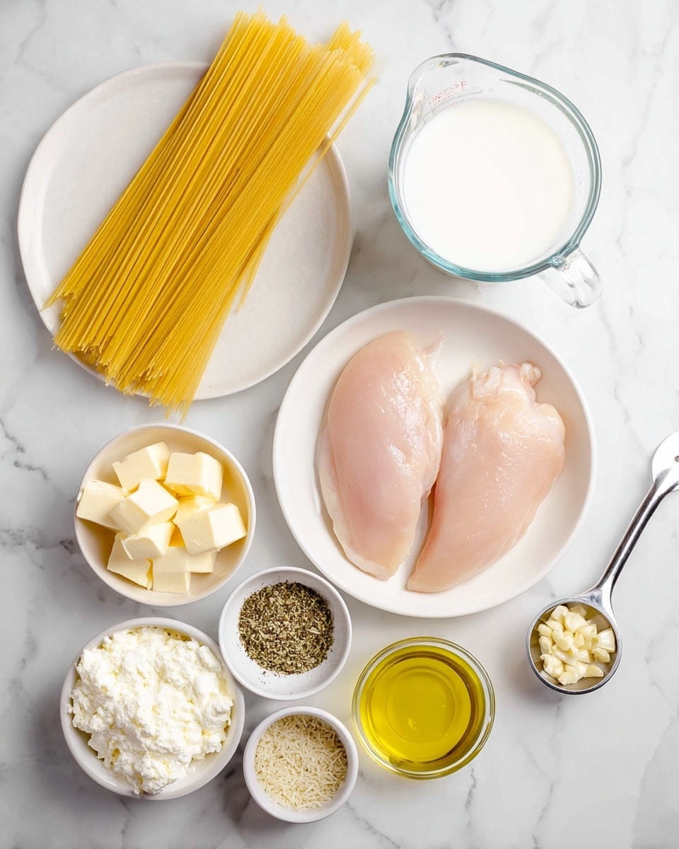 The image shows several cooking ingredients arranged on a white marbled surface. There is a white bowl with two raw, pale pink chicken filets in the center right. Above it is a clear glass measuring cup filled with white milk. On the left, there is a bundle of uncooked yellow spaghetti pasta resting on a white plate. Below the chicken, there are small white bowls containing pale yellow butter cubes, grated white cheese, and white sour cream or cream cheese. Additionally, there is a small bowl with mixed dried herbs and spices in green, black, beige, and white colors. A small glass bowl holds golden yellow olive oil, and next to it is a metal measuring spoon with minced garlic. The clean and organized layout highlights each ingredient clearly. photo taken with an iphone --ar 4:5 --v 7