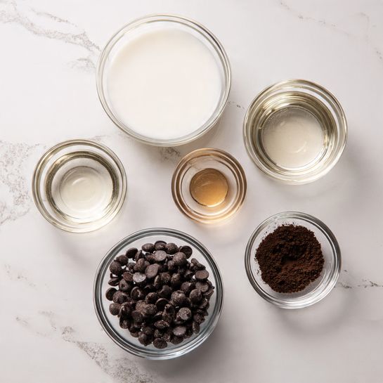 The image shows six clear glass bowls on a white marbled surface. Starting from the top left, a large bowl is filled with white liquid, next to it on the top right is a medium bowl with the same white liquid. Below the first bowl is a smaller bowl with light brown liquid, next to it on the right is a medium bowl filled with dark brown powder. In the center near the bottom is the largest bowl filled with dark brown chocolate chips, all arranged neatly in a simple layout. photo taken with an iphone --ar 4:5 --v 7
