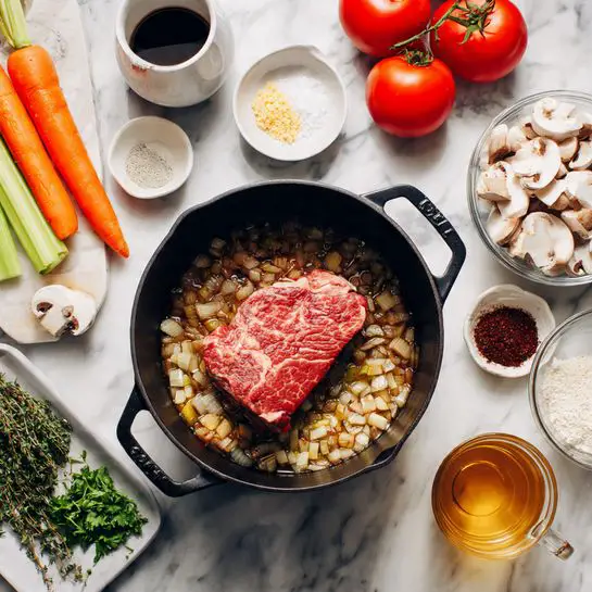 In the center of the image, there is a black cast iron pot filled with diced and browned onions at the bottom layer, creating a dark golden-brown textured base. On top of this layer rests a large raw piece of marbled red beef, positioned slightly off-center to the left. Surrounding the pot on a white marbled surface are various fresh and prepared ingredients: two carrots and two celery sticks on the upper left, a small white bowl with dark liquid above the pot, two whole red tomatoes near the top right corner, a small white bowl with salt and black pepper next to the tomatoes, a glass measuring cup with a clear liquid on the far right, a glass bowl filled with sliced white and brown mushrooms on the bottom right, a small dish of fresh green herbs near the bottom center, a small white bowl filled with white powder near the bottom center right, a small heap of dark red paste in a clear container to the right of this bowl, and a glass mug filled with amber-colored liquid on the bottom left. The entire arrangement is neatly spread on the white marbled surface. Photo taken with an iphone --ar 4:5 --v 7