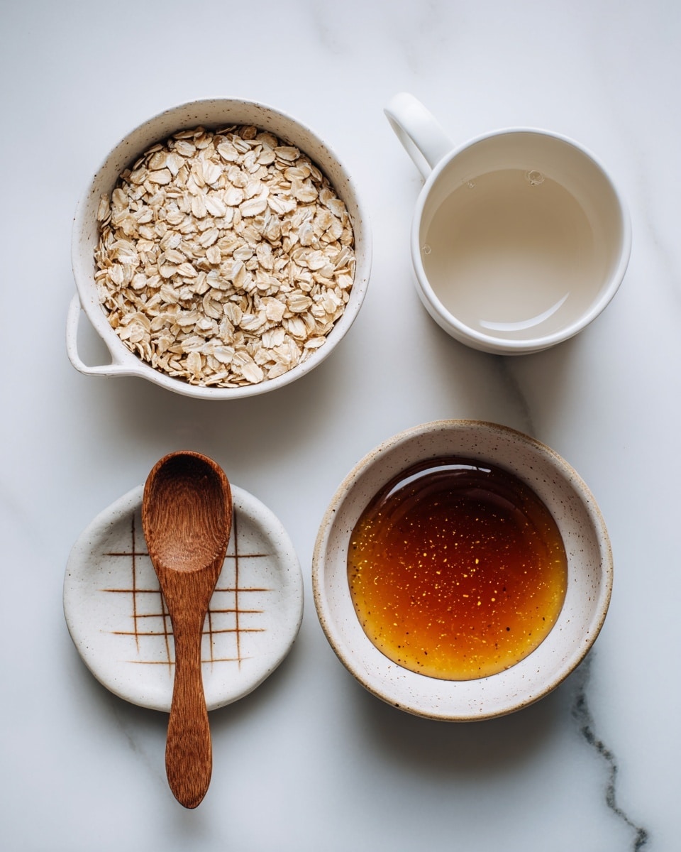 The image shows a white measuring cup filled with rolled oats at the top left, next to a white cup with water on the top right. Below these, there is a small white bowl with a grid pattern of brown sauce on the left and a shallow white bowl filled with golden honey on the right. A wooden spoon with a rounded handle rests between the two bowls. All items are arranged on a white marbled surface. Photo taken with an iphone --ar 4:5 --v 7