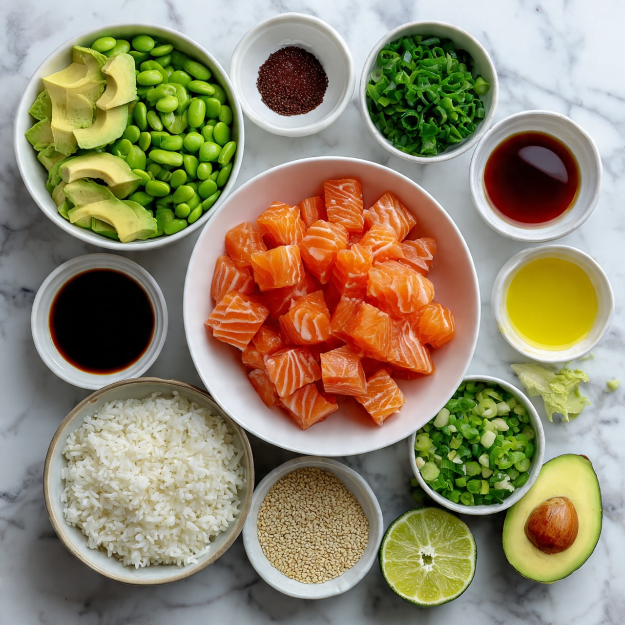The image shows a big white bowl in the center full of bright orange raw salmon chunks with white stripes. Around it, there are smaller white bowls with different ingredients: green sliced avocado on the left, green edamame beans below, white rice mixed with green herbs on the right bottom, chopped green cucumber pieces in the top right, chopped green onions to the right, and black and white sesame seeds near the top. There are also small white bowls with dark soy sauce, red sauce, light honey, light yellow oil, and a small bowl with a slice of lime and half an avocado on the right side. Everything is laid out on a white marbled surface. Photo taken with an iphone --ar 4:5 --v 7