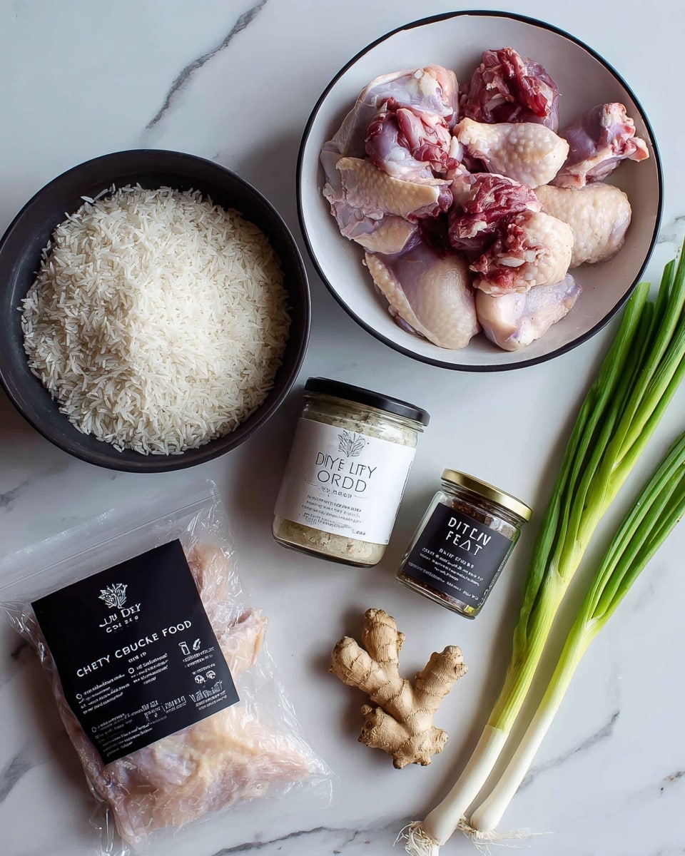 The image shows various ingredients placed on a white marbled surface. On the left, there is a black pot filled with uncooked white rice. Next to it, a white bowl with a black rim holds raw chicken pieces with a mix of pale pink skin and darker red meat. Below the bowl, there is a vacuum-sealed pack containing more raw chicken, pale pink in color. In the center, two jars are visible, one labeled