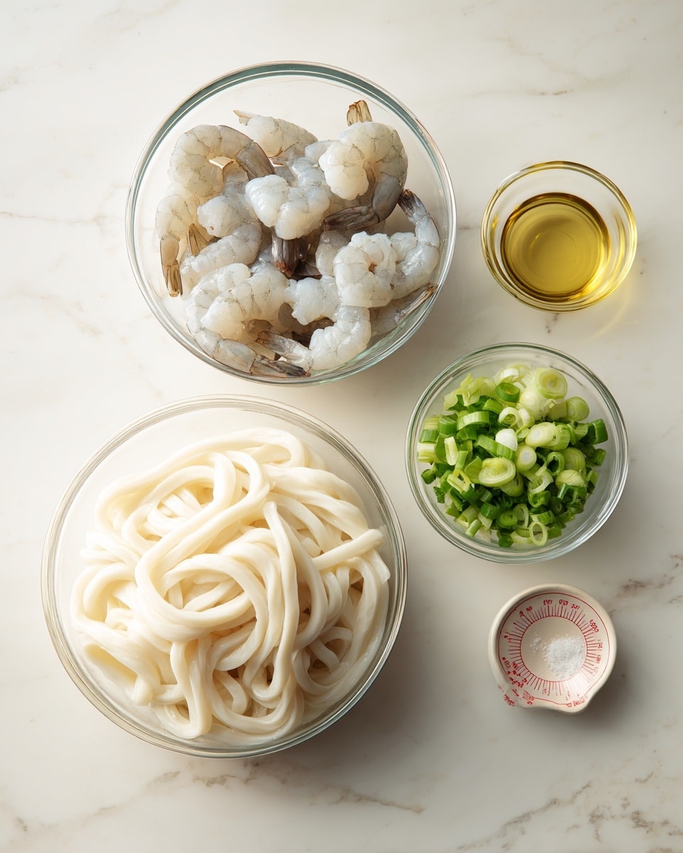 The image shows four clear glass bowls on a white marbled surface. The largest bowl in the front contains a block of thick, white udon noodles with a smooth and slightly glossy texture. To the left, a medium bowl holds several peeled shrimp that are pale gray with some darker streaks and visible tails. Near the top right, a small bowl contains chopped green onions with bright green and white pieces. Next to it, a tiny measuring cup with red markings holds a small amount of light yellow oil. photo taken with an iphone --ar 4:5 --v 7