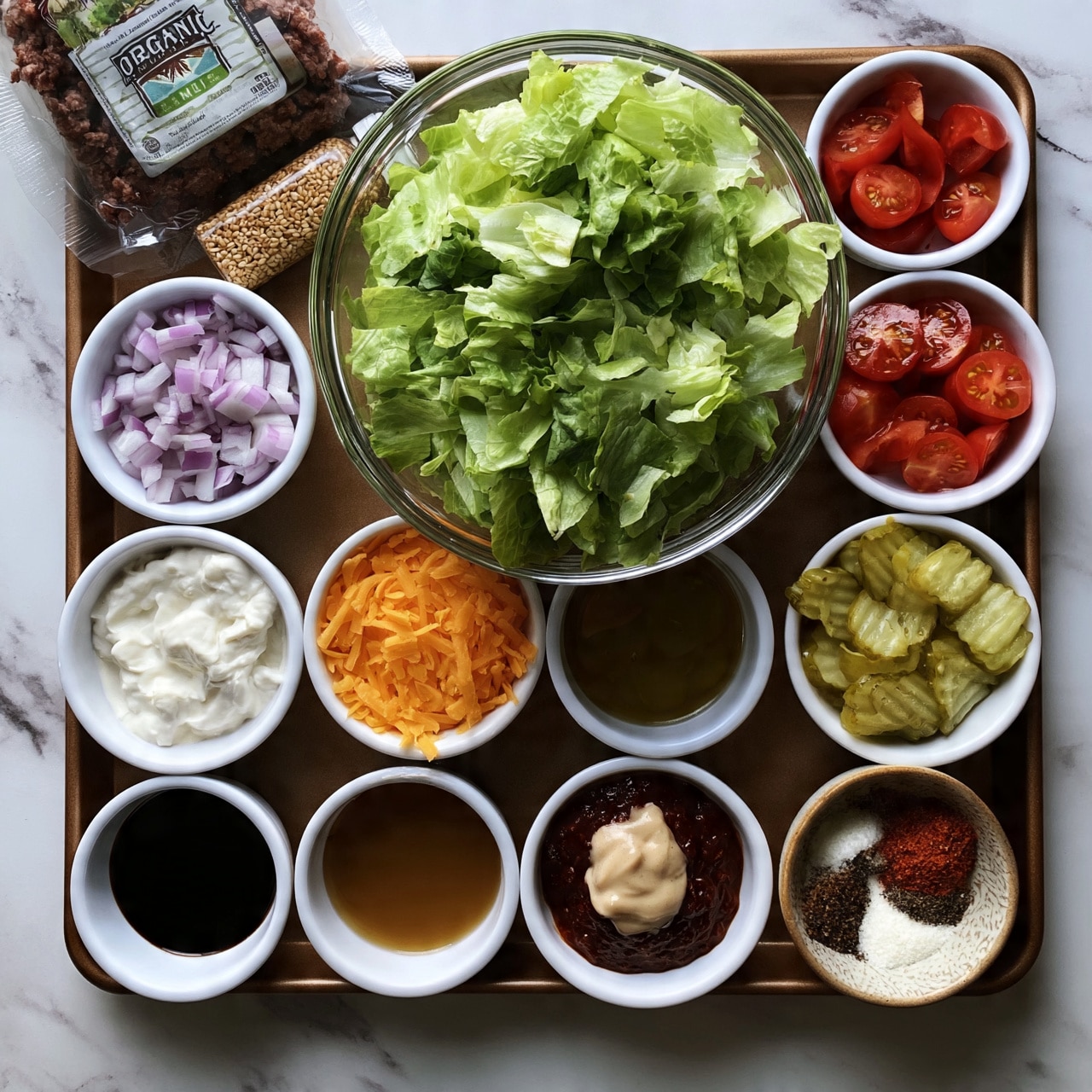 square image The image shows a white marbled surface with a brown tray holding various ingredients in white bowls arranged neatly. In the top middle is a large clear bowl filled with chopped green lettuce. Surrounding it are smaller white bowls containing diced red onions, halved cherry tomatoes, sliced pickles, shredded orange cheese, a mix of white creamy sauces, dark soy sauce, light brown liquid, a dark reddish sauce topped with a dollop of light beige sauce, and spices in a bowl with red and white powders. On the top left corner of the tray is a package of organic ground meat and a small bottle of toasted sesame seeds lying horizontally. Photo taken with an iphone --ar 4:5 --v 7