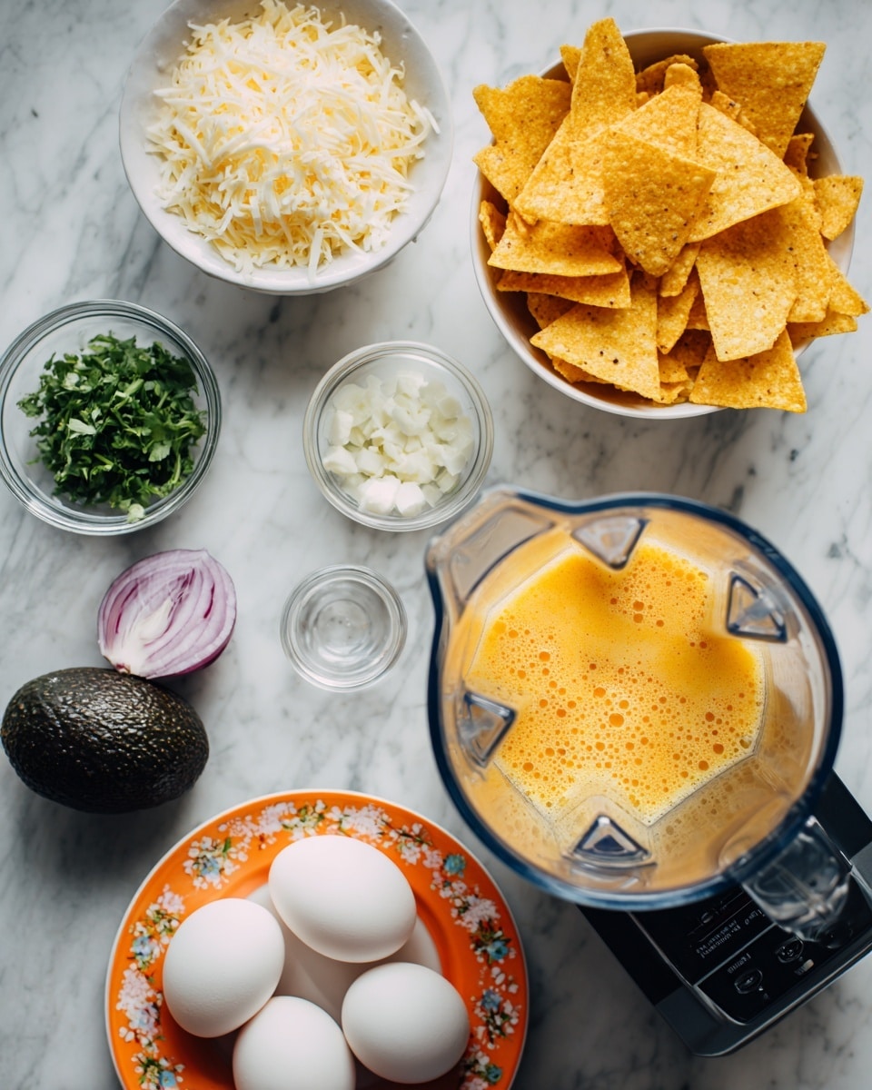 The image shows a top view of a white marbled surface with several food items arranged around a blender filled with a light orange liquid with some bubbles and visible blender blades. At the top center, there is a white bowl filled with triangular yellow corn chips stacked loosely. Moving clockwise, there is a small white bowl with chopped white onions, another small white bowl with crumbly white cheese, and a small transparent container with a white liquid. At the bottom, an orange plate with floral patterns holds four white eggs and a small white bowl with finely chopped red onions. To the left, there is a whole dark avocado and a small white bowl containing chopped green herbs. Photo taken with an iphone --ar 4:5 --v 7