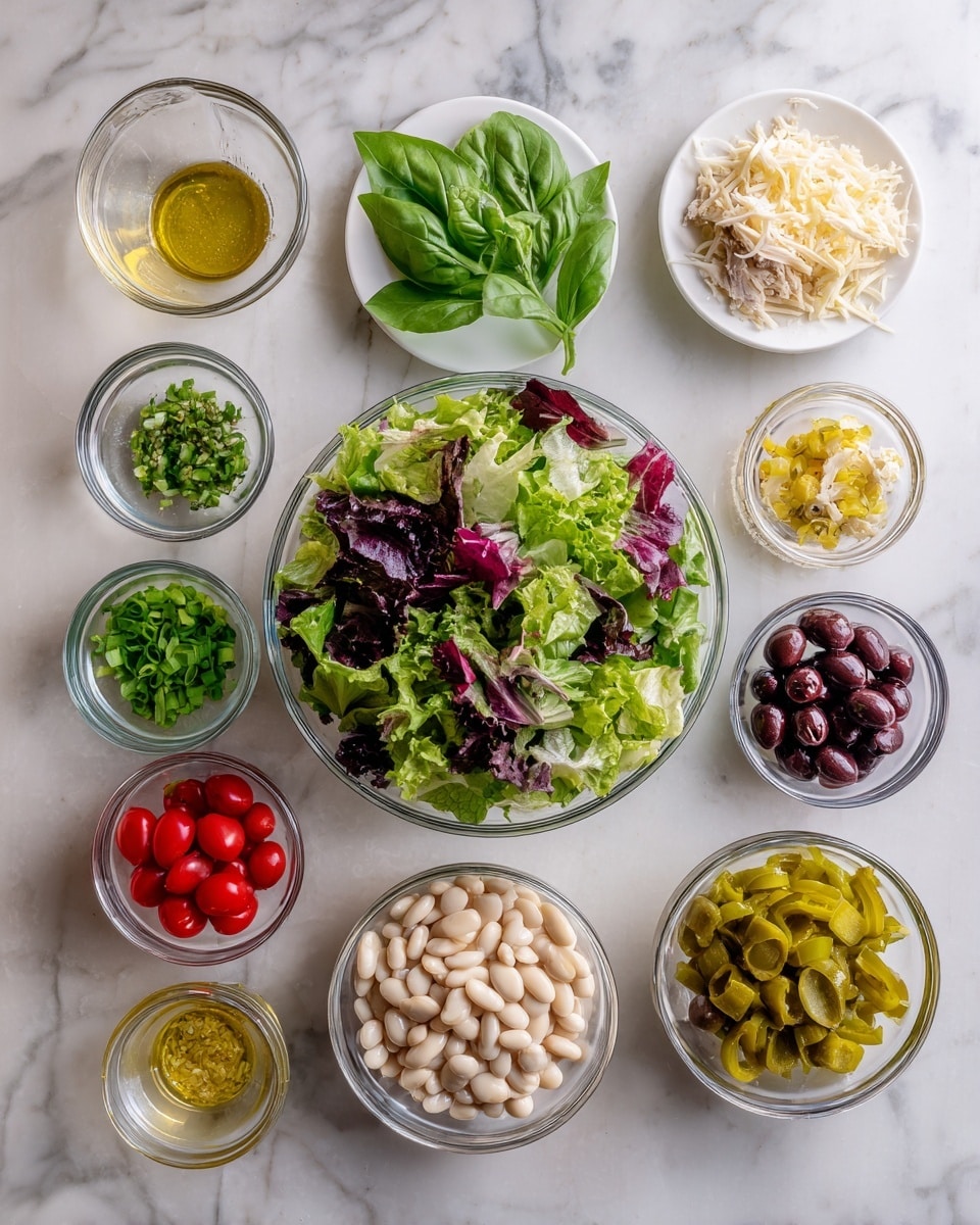 A clear glass bowl in the center full of a mix of green and purple leafy salad, with different shades of green and purple leaves, giving a fresh and crisp look. Around it, on a white marbled surface, there are eight smaller clear bowls and one white plate arranged neatly. Starting from the top right going clockwise: a white plate with fresh green basil leaves and shredded white cheese, a small clear bowl with shredded light beige chicken placed to the right, a clear measuring cup filled with yellow salad dressing mixed with herbs, a small white bowl filled with chopped green scallions, a clear bowl with shiny dark purple olives, a clear bowl with round red cherry tomato halves, a small clear bowl with light yellow-green pickled peppers, and a clear bowl at the center bottom filled with white beans. The overall colors are fresh greens, reds, whites, yellows, and purples on a clean white marble surface, with a neat and organized layout. photo taken with an iphone --ar 4:5 --v 7