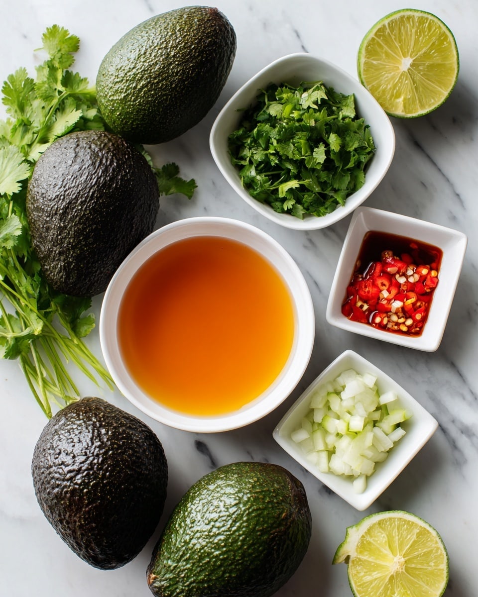 Three dark green avocados with rough skin lie on a white marbled surface. Around them are six white bowls and a half-cut green lime; the largest bowl holds orange-colored broth, a smaller bowl has a clear liquid, another bowl is filled with green fresh cilantro leaves, a square bowl contains white chopped onions, and a tiny square dish holds red chopped chili and light yellow minced garlic. The whole setup is clean and bright with natural light. photo taken with an iphone --ar 4:5 --v 7