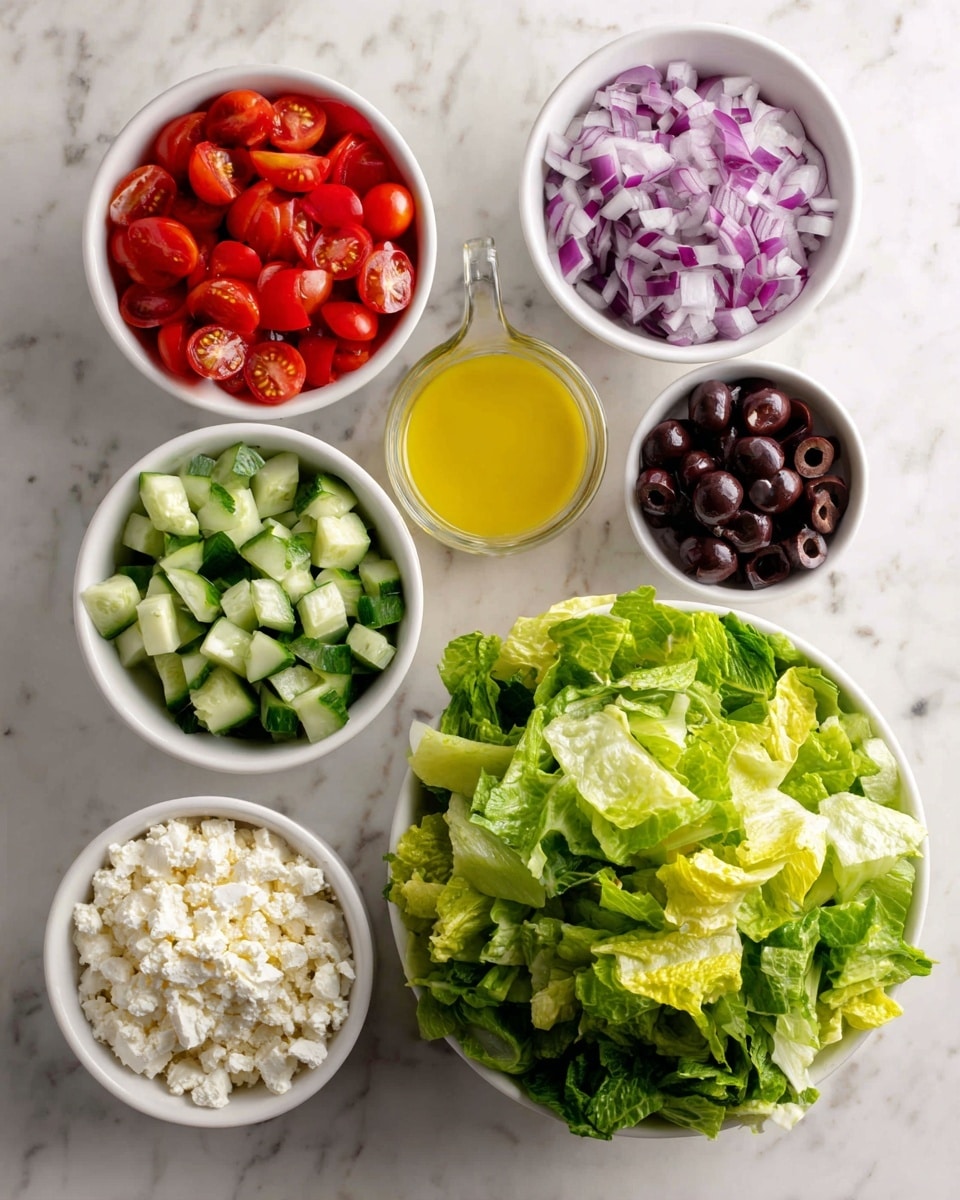 The image shows six small white bowls arranged on a white marbled surface, each containing different salad ingredients. At the bottom right, there is a larger white bowl filled with mixed green lettuce leaves. Surrounding it, clockwise from the top left, are white bowls holding sliced red cherry tomatoes, a measuring cup with yellow salad dressing, chopped green cucumber, crumbled feta cheese, sliced black olives, and finely sliced purple onions. The colors are bright and fresh, with green, red, purple, white, black, and yellow all visible. Photo taken with an iphone --ar 4:5 --v 7
