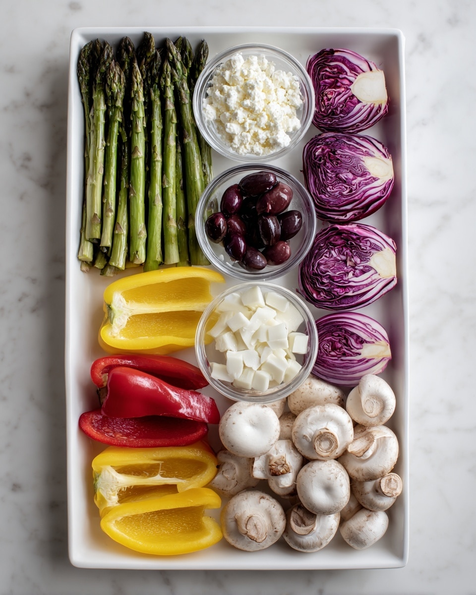 The image shows a white rectangular tray filled with six sections of different food items neatly arranged in rows. On the left, bright green asparagus spears line up against the tray edge. Next to the asparagus, a small clear bowl holds white crumbled cheese, followed by another small clear bowl filled with dark purple olives. In the middle row, there are four yellow bell pepper halves and four red bell pepper halves arranged in two pairs with their glossy interiors exposed. To the right, three purple and white radicchio heads sit above three quarter red onions with smooth purple and white layers visible. At the bottom right, there are twelve pale mushroom caps grouped tightly. The tray rests on a white marbled surface. photo taken with an iphone --ar 4:5 --v 7
