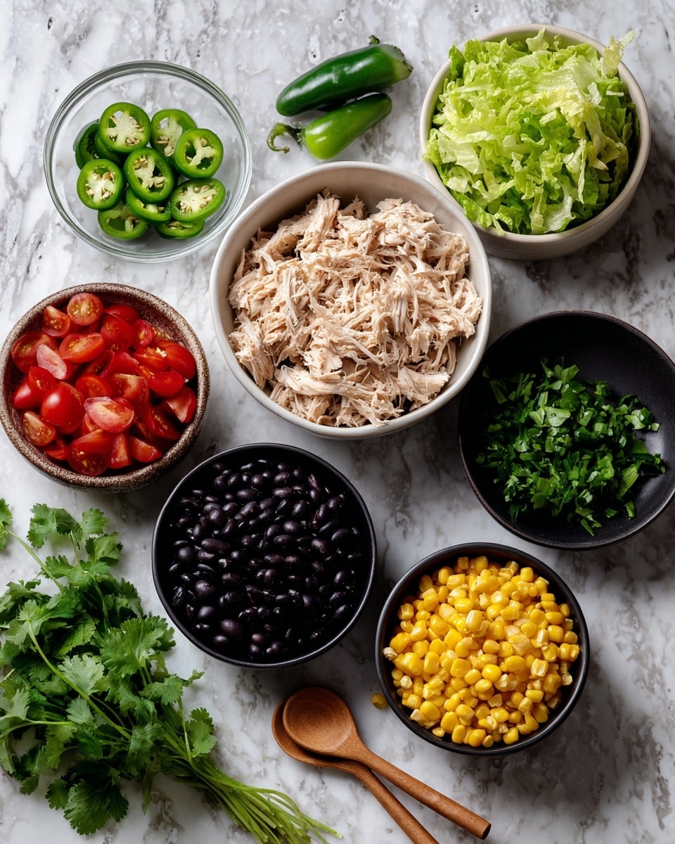 The image shows several bowls and ingredients arranged on a white marbled surface. There is a white bowl filled with shredded cooked chicken, a black bowl of chopped fresh green lettuce leaves, another black bowl with bright red chopped tomatoes, a white bowl filled with shiny black beans, and a black bowl full of yellow corn kernels. To one side, there are several slices of fresh green jalapeño, and a bunch of fresh green cilantro leaves next to them. Two small wooden spoons lie between the bowls. The setting looks fresh and ready for making a meal, photo taken with an iphone --ar 4:5 --v 7