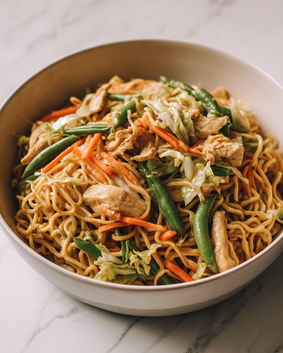 The image shows a close-up of a noodle dish with three main layers. The bottom layer is light brown noodles that are thin and slightly shiny, twisted and tangled together. The middle layer has pieces of cooked chicken in light brown shades, scattered evenly across the noodles. The top layer features green beans and thin strips of orange carrots mixed with light-colored shredded cabbage, giving color and texture contrast. The whole dish is in a deep white bowl with a smooth texture, placed on a surface with a white marbled texture. photo taken with an iphone --ar 4:5 --v 7