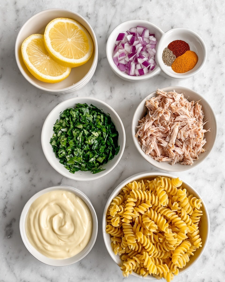 The image shows six white bowls placed on a white marbled surface. The top left bowl contains four lemon wedges. Next to it on the right is a small bowl with three different colored spices: red, brown, and orange. Below and to the left is a bowl filled with chopped green herbs and diced red onions, arranged side by side. To the right of that is a bowl filled with yellow pasta spirals. At the bottom left is a bowl holding three different creamy sauces or dips that are light yellow, white, and beige. Finally, the bottom right bowl is filled with shredded pale brown tuna. The arrangement is neat and colorful. Photo taken with an iphone --ar 4:5 --v 7