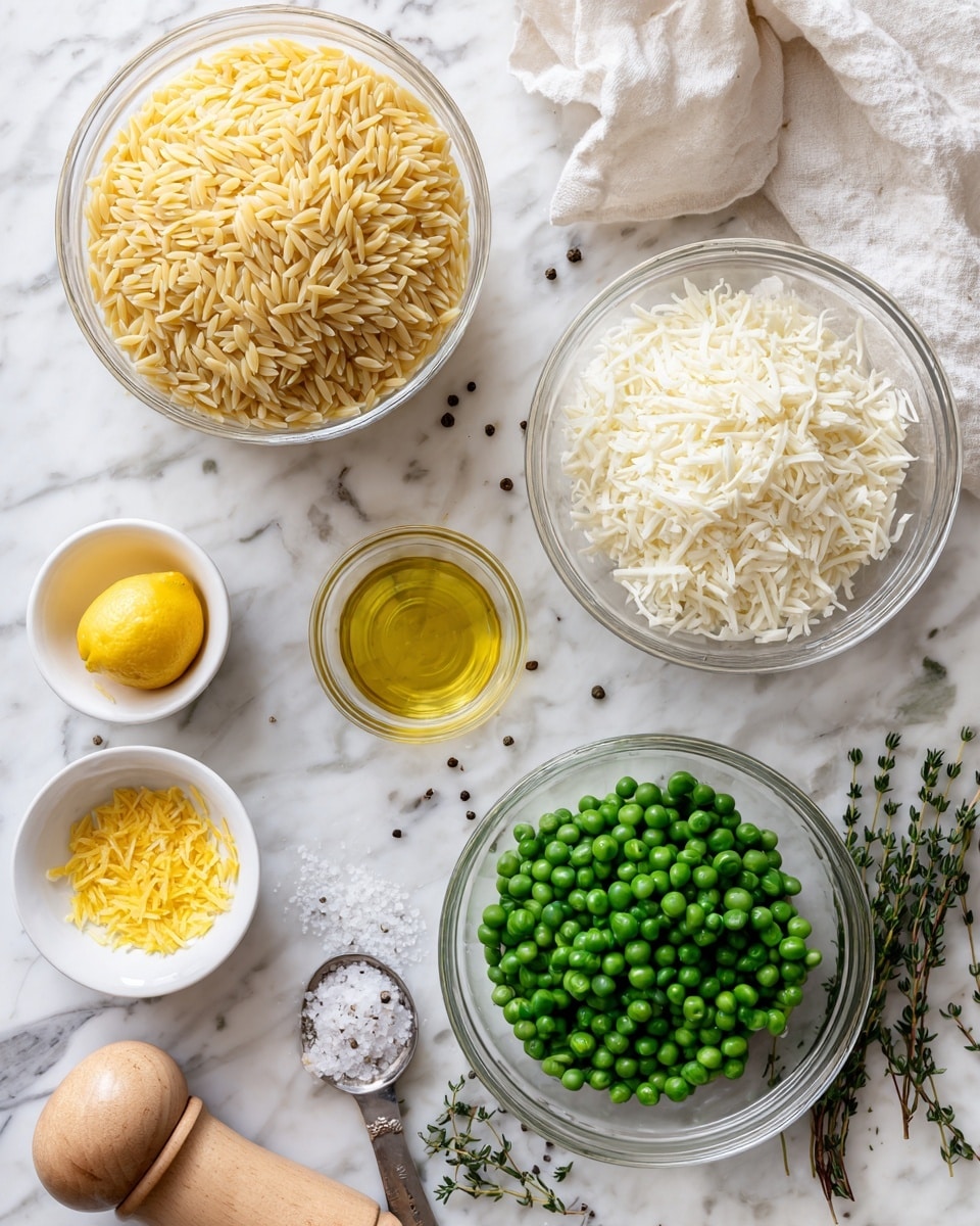 The image shows ingredients arranged neatly on a white marbled surface. In the center, there is a clear bowl of uncooked golden orzo pasta with a rough texture. Below it and to the right is a glass bowl full of frozen green peas, round and frosty. To the right of the orzo is another clear bowl filled with white shredded cheese that looks soft and fluffy. Above the peas is a small glass cup with a golden yellow liquid, likely olive oil, shiny and clear. Below the orzo are three small white bowls: one with yellow lemon zest, another with pale yellow lemon juice, and a third with minced white garlic. On the left side, there is a whole yellow lemon and a wooden pepper grinder with some black pepper spilled beside it. A silver measuring spoon with white salt rests nearby. On the bottom right, fresh thyme sprigs with green leaves add color. The background has a soft white cloth casually placed behind the orzo bowl. The whole setup looks clean and bright, ready for cooking. Photo taken with an iphone --ar 4:5 --v 7