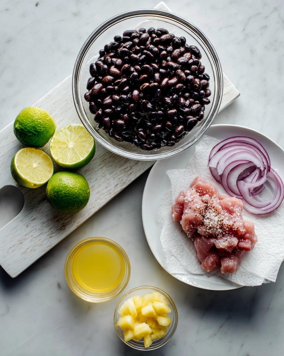 An overhead view shows ingredients for cooking arranged on a white marbled surface. On the left, a white cutting board holds a clear glass bowl with dark cooked beans on top, next to bright green lime wedges in the top right corner of the board. Below the lime wedges are thin slices of light purple onion. Near the bottom left corner, a small clear glass cup holds light yellow juice, and right next to it, a small clear glass bowl has small yellow pineapple chunks. To the right of the cutting board is a white plate with light pink raw meat sprinkled with white seasoning on a paper towel. Photo taken with an iphone --ar 4:5 --v 7