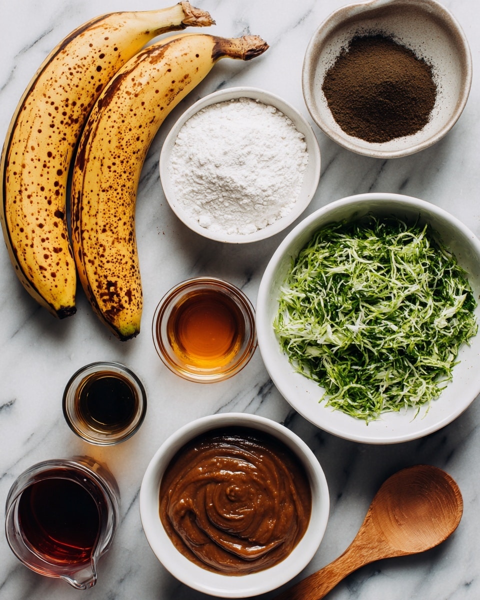 The image shows an overhead view of several ingredients on a white marbled surface. There are two ripe bananas with brown spots placed side by side at the bottom left. To the top right of the bananas, a small white bowl filled with a dark brown powder sits beside a wooden spoon holding white flour. Above these, a larger white bowl contains green shredded vegetables, looking fresh and finely chopped. Next to it, a small glass container holds a dark amber liquid, and another small jug contains a similar dark brown liquid. Near the bottom left, there is a medium white bowl filled with a thick brown mixture that looks smooth. The items are neatly arranged in a loose circle, showing a variety of textures and warm, earthy colors in contrast with the bright white background. photo taken with an iphone --ar 4:5 --v 7