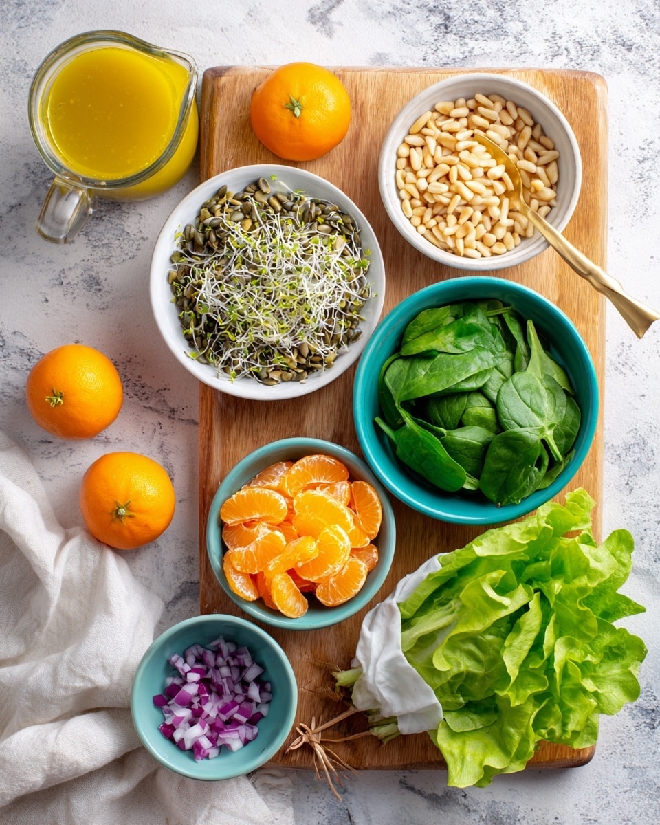 The image shows a wooden board on a white marbled surface with various fresh salad ingredients arranged neatly. On the board, there is a white bowl with sprouted seeds in the center, two turquoise bowls on the right and left containing bright green spinach leaves and vibrant orange mandarin segments, respectively. A smaller white bowl filled with light-colored pine nuts is placed above the salad bowls. To the left side of the board, there are three small orange mandarins on the marbled surface. Below the board, a bunch of fresh green leafy lettuce partially wrapped in a white cloth is visible. A small turquoise bowl with finely chopped red onion sits on the lower left corner of the board next to a golden spoon holding some yellow salad dressing, with a clear glass measuring jug of the same yellow dressing positioned on the marbled surface at the top left corner. Photo taken with an iphone --ar 4:5 --v 7