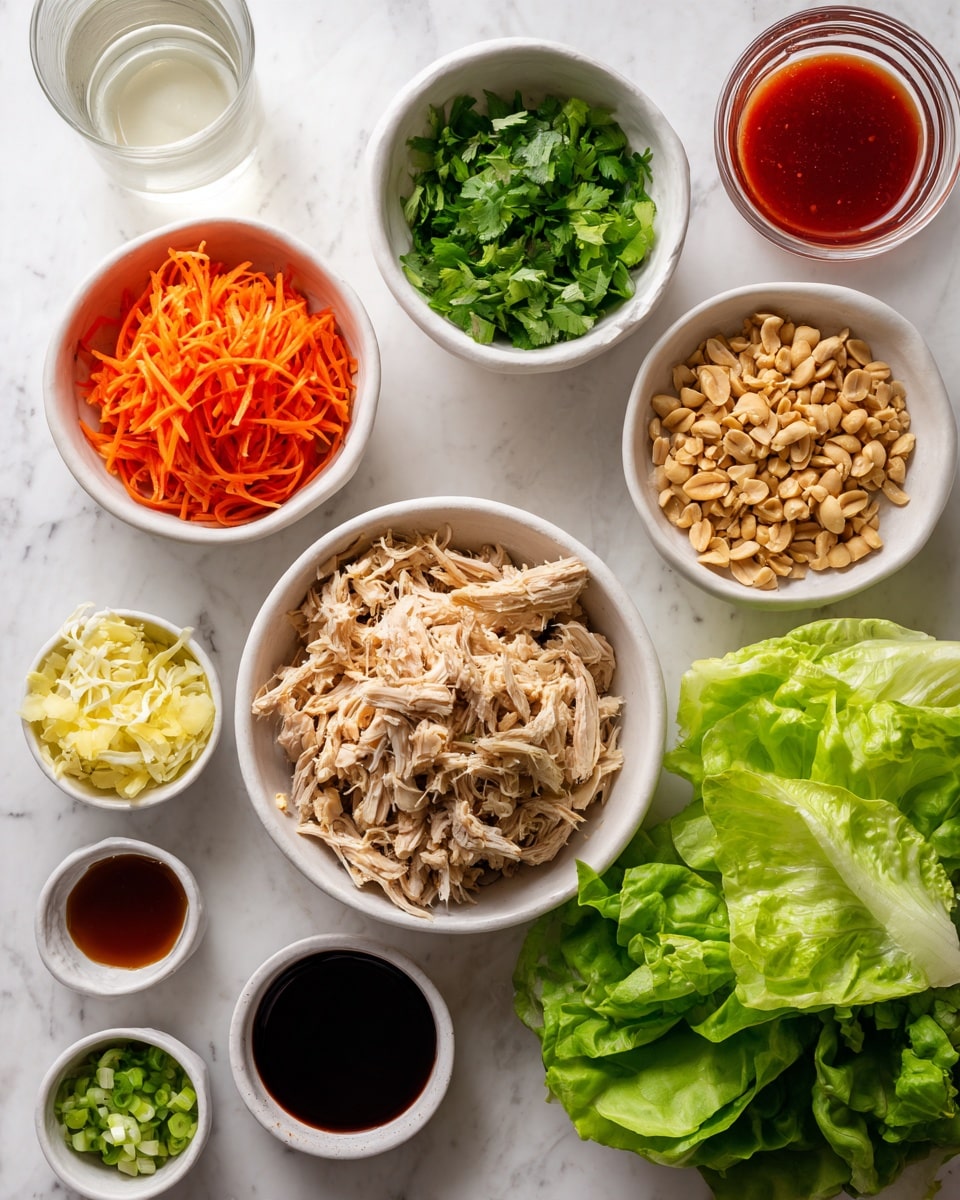The image shows an arrangement of several bowls and small containers on a white marbled surface. In the center is a white bowl filled with shredded light brown chicken. To the left is a white bowl with bright orange shredded carrots, below it a smaller white bowl with fresh green herbs. To the right of the chicken is a white bowl filled with chopped green onions, and below that a glass filled with chopped peanuts. In the bottom right corner is a white bowl or plate holding large, fresh green lettuce leaves. There are also small white containers with light yellow grated ginger, and dark soy sauce. Two bowls contain sauces, one light brown and the other bright red. A glass of clear white liquid sits at the top left. The setup is neat and clean, highlighting fresh and colorful ingredients. Photo taken with an iphone --ar 4:5 --v 7