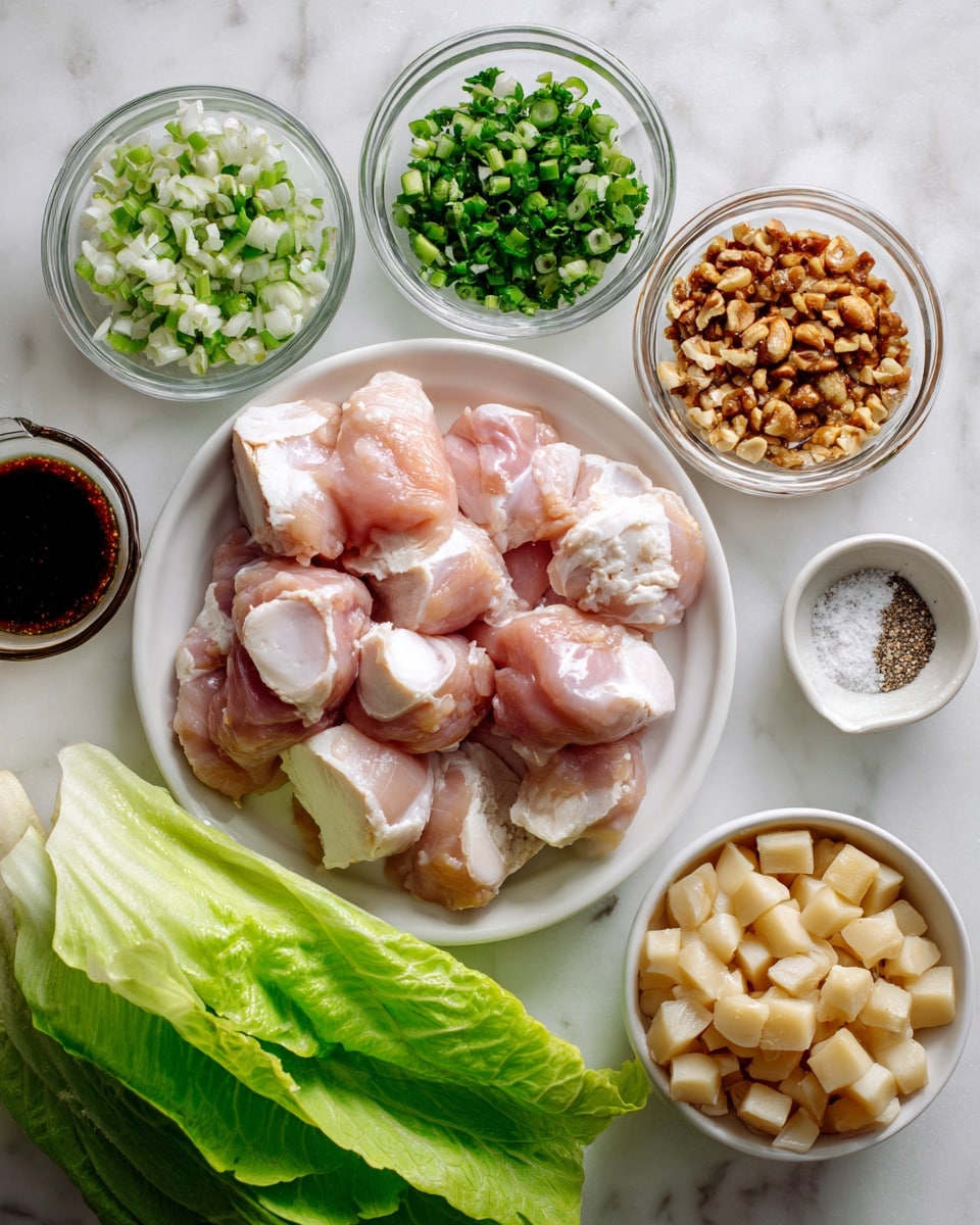 A white plate in the center holds several pieces of raw light pink chicken with white fat edges, layered loosely. Surrounding it on a white marbled surface are small clear glass bowls with different ingredients: chopped green herbs on the top left, crushed light brown nuts on the top right, dark brown sauce with small bits in the middle top, a dark soy sauce on the bottom left, chopped light green scallions just above that, and a small dish with white salt and black pepper to the right. On the bottom right, there is a white bowl filled with diced light tan water chestnuts. At the bottom center, there are fresh, large green lettuce leaves loosely stacked. Photo taken with an iphone --ar 4:5 --v 7