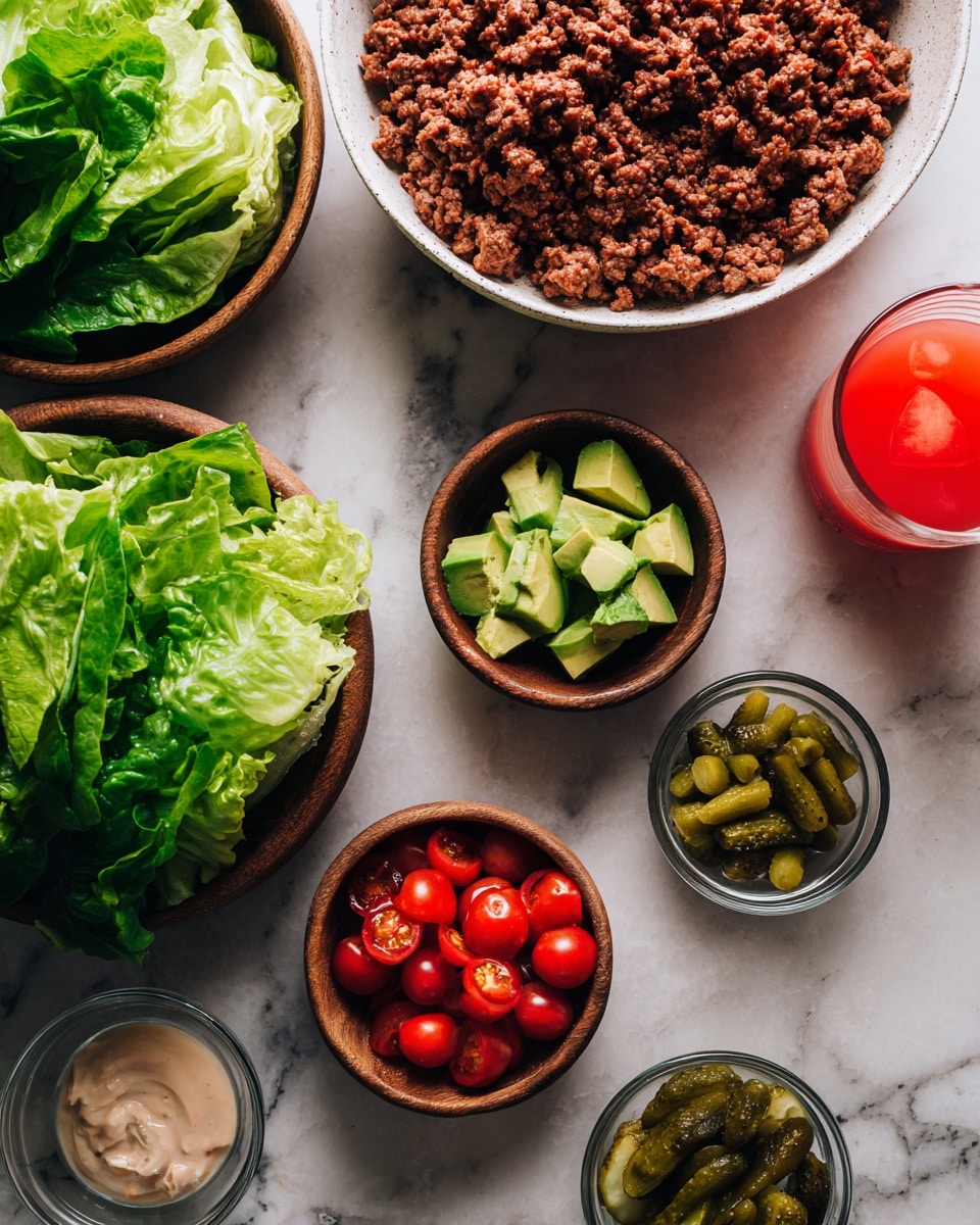 The image shows a white marbled surface holding several bowls with food ingredients. Two wooden bowls contain fresh green lettuce leaves, one larger and one smaller. A large white bowl filled with cooked ground meat sits on the upper left side. Surrounding these are small clear glass bowls: one with sliced green avocado, one with halved red cherry tomatoes, one with small sliced green pickles, and one with a light-colored creamy sauce. A bright red drink in a clear glass is placed near the top right. A woman's hand is not visible in the image. photo taken with an iphone --ar 4:5 --v 7